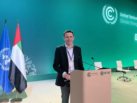 stephen nolan in front of a lecturn at a conference hall