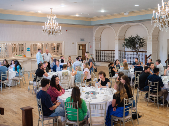 image of the Nutritics summer event with people sat round a dinner table