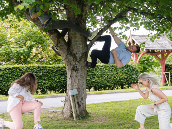 image of Damian hanging from a tree