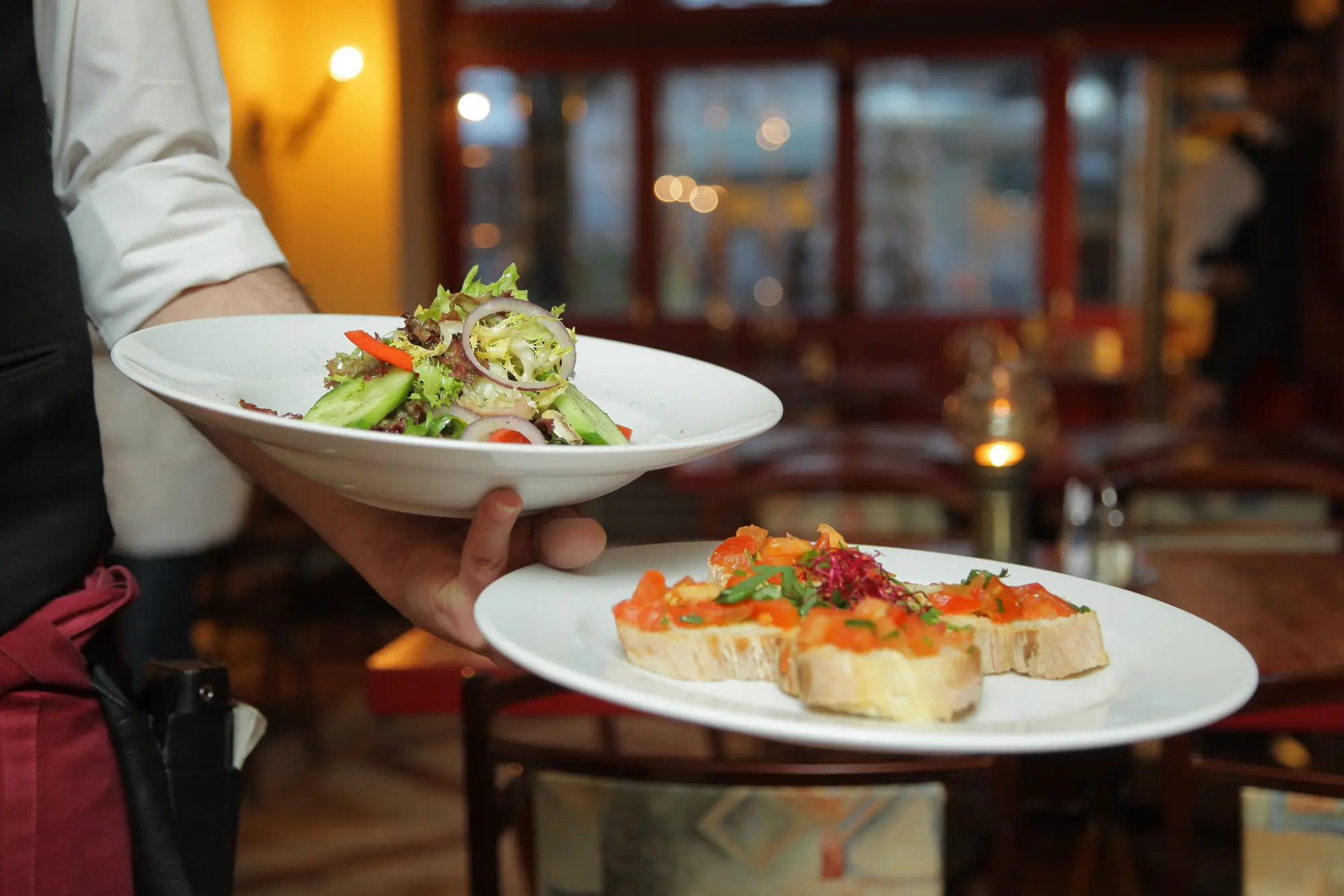 waiter holding plates