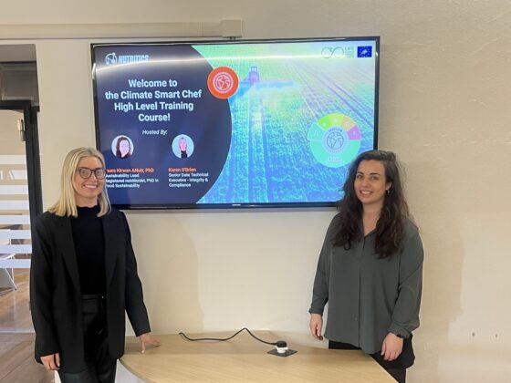 laura and karen in front of a screen at climate smart chef